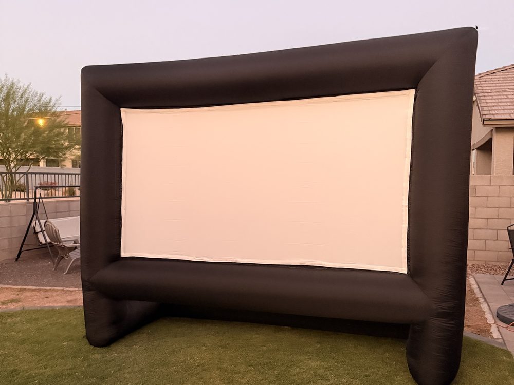 Inflatable movie screen set up on a lawn